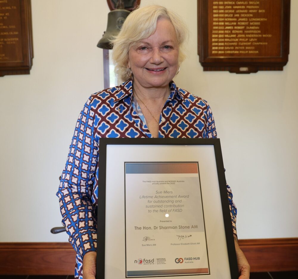 Dr Sharman Stone receiving the Sue Miers Lifetime Achievement Award